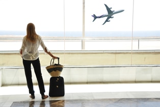 a woman looking at an airplane