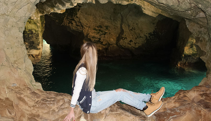 Watching the waves from a grotto